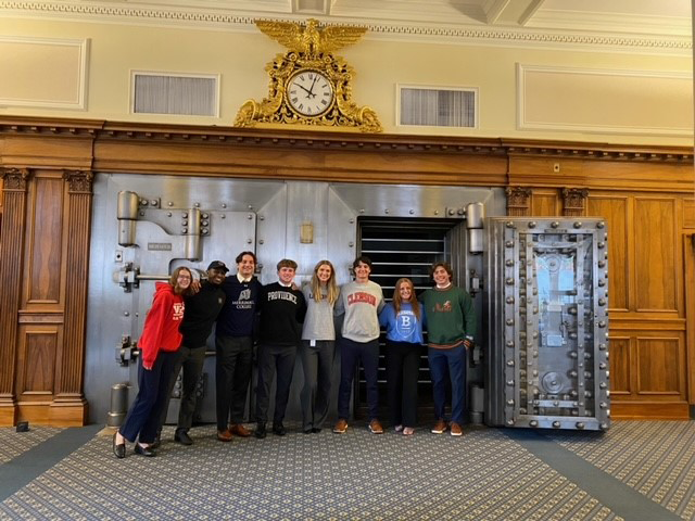 Salem Five intern group standing in front of Bank vault.